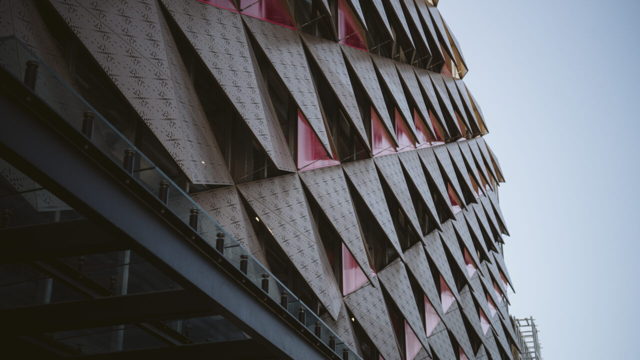 Modern building exterior featuring diamond-pattern laser-cut cladding showcasing Laser 3D precision work