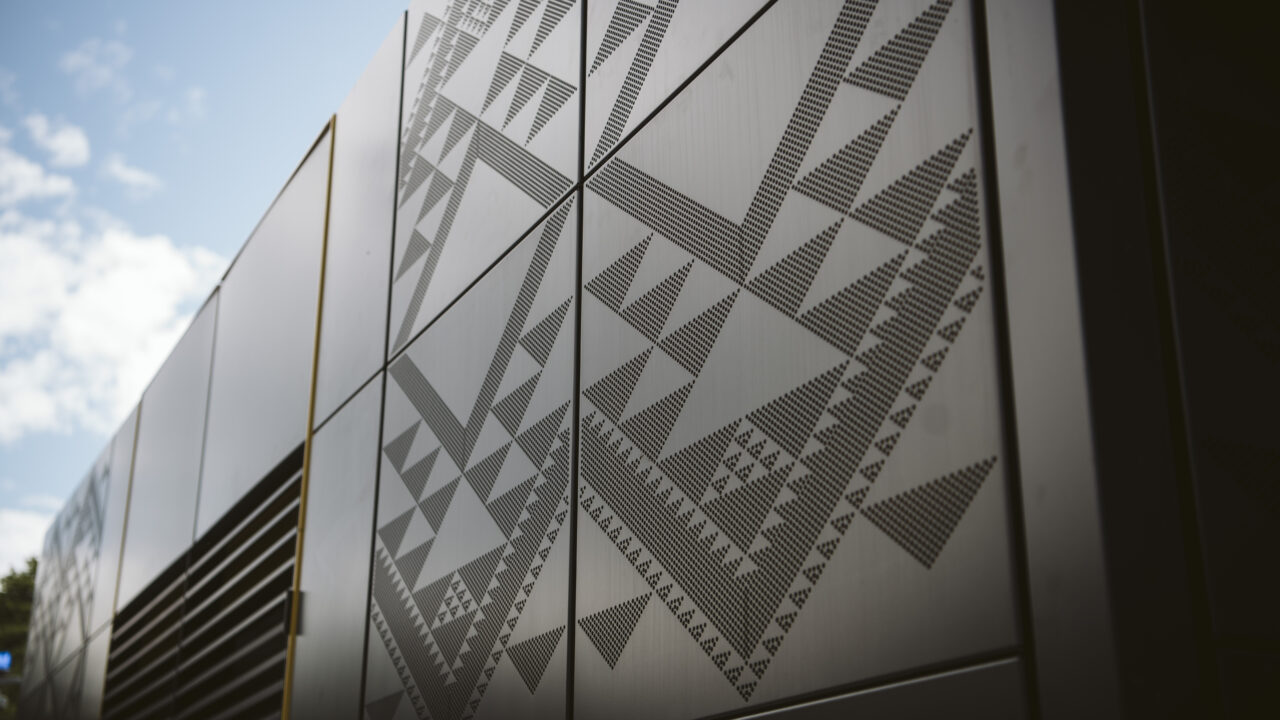 Close-up of laser-etched geometric patterns on metal panels showcasing Laser 3D’s precision engraving