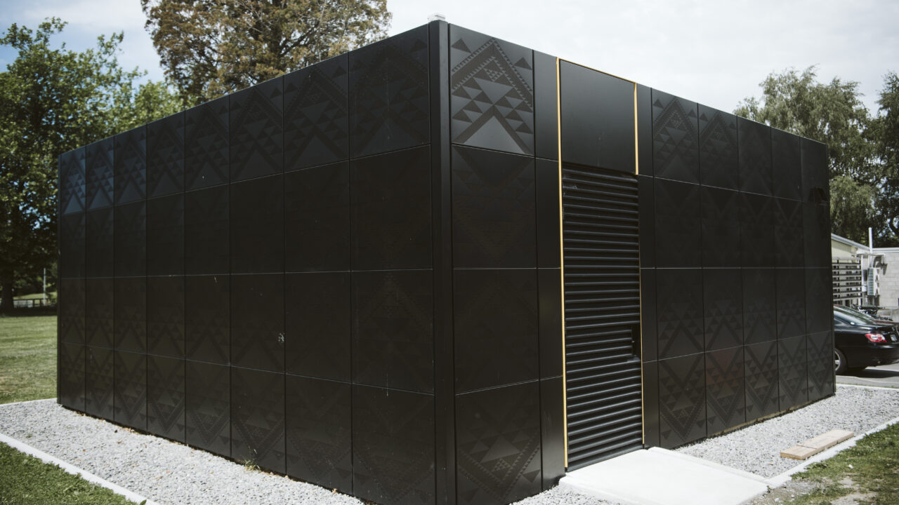 Modern black building exterior with laser-cut metal cladding panels fabricated by Laser 3D