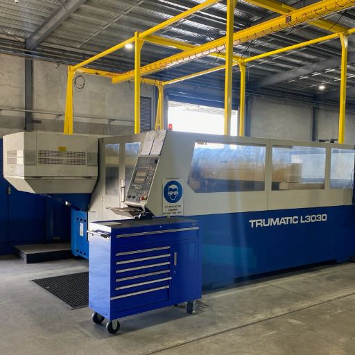 A Trumpf 3030 laser cutter inside a warehouse.
