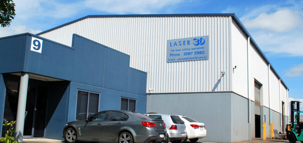An office and large warehouse, with a Laser 3D sign on the side.